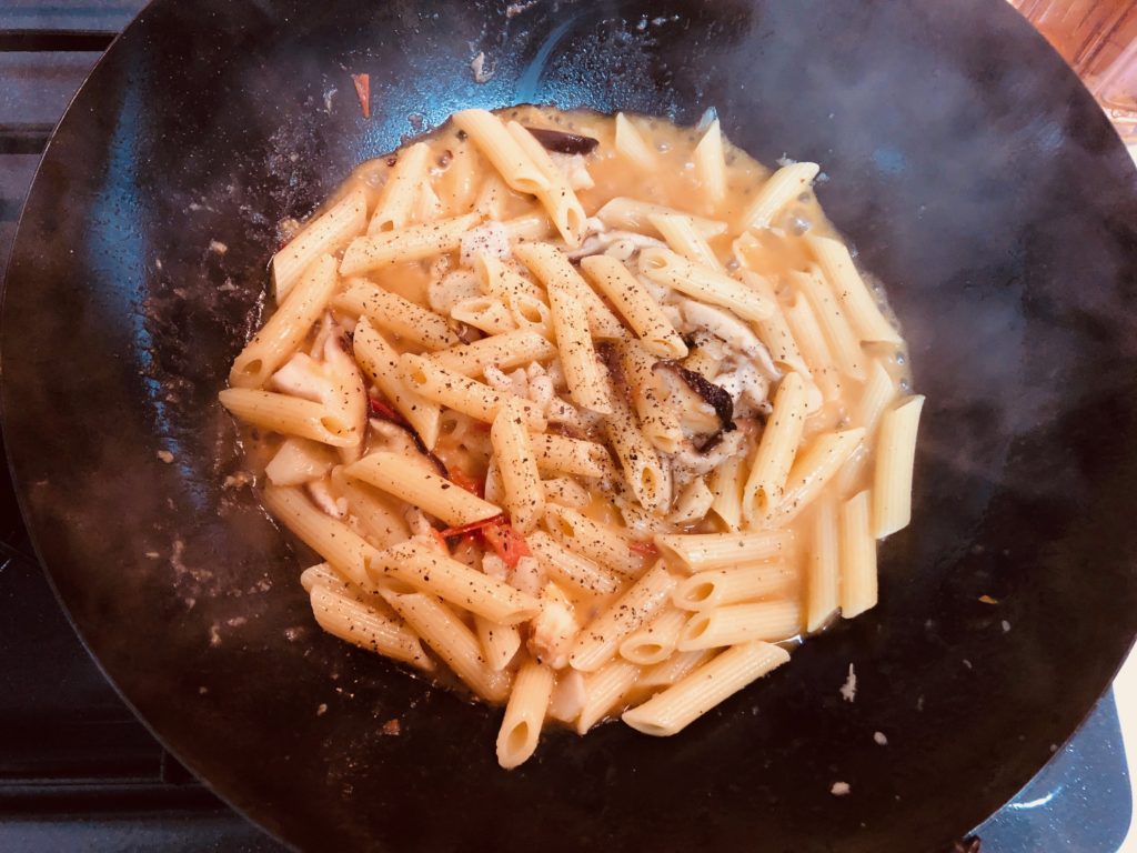 Add penne and season with salt and pepper